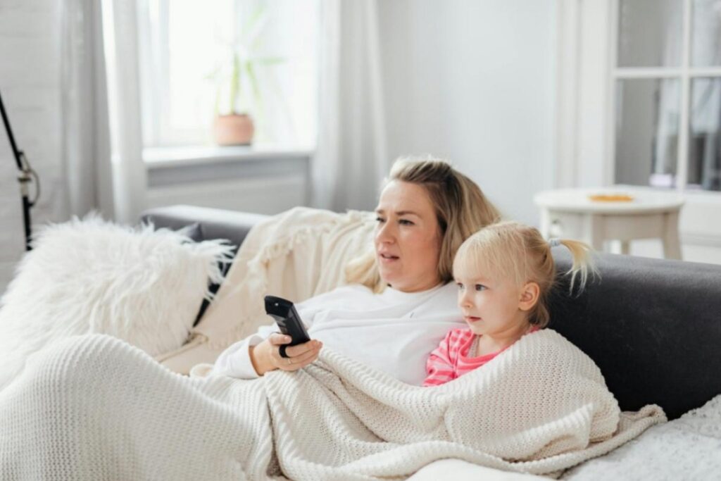 What to Do If Your Ex Wants to Move Out of State With Your Child A mother and her daughter are watching TV